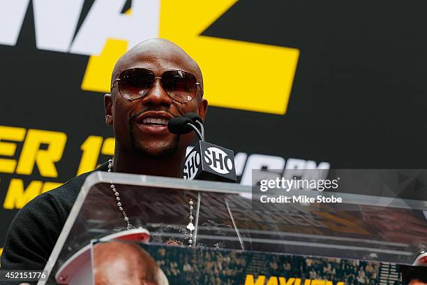 Floyd Mayweather Jr. Speaks to the media during a news conference at the Pedestrian Walk in Times Square on July 14, 2014 in New York City. Floyd...