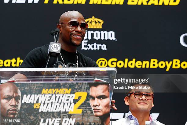 Floyd Mayweather Jr. Speaks to the media during a news conference at the Pedestrian Walk in Times Square on July 14, 2014 in New York City. Floyd...