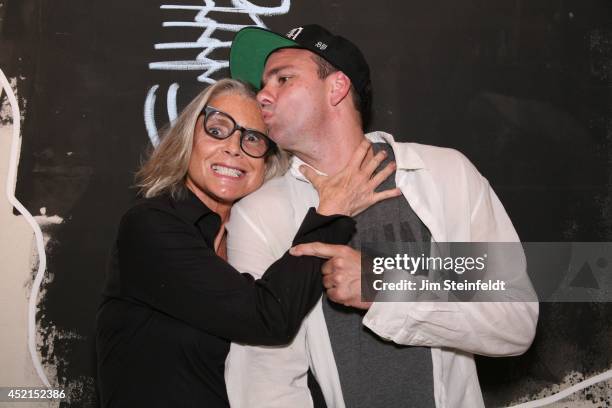 Artist Danny Minnick at his art exhibit poses with Marylin Hassett at Gallerie Sparta in Los Angeles, California on July 10, 2014.