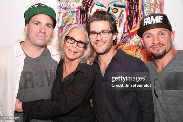 Artist Danny Minnick at his art exhibit poses with Marylin Hassett, Johnny Whitworth, and Fabian Alomar at Gallerie Sparta in Los Angeles, California...