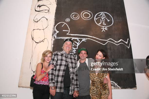 Artist Danny Minnick at his art exhibit poses with Sasha Cassavetes, Nick Cassavetes, and Gina Cassavetes at Gallerie Sparta in Los Angeles,...