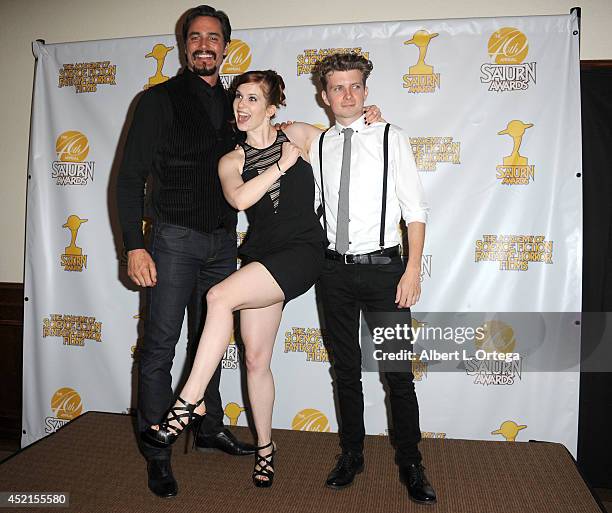 Actors Victor Webster, Magda Apanowicz and Erik Knudsen from 'Continuum' pose inside the press room of the 40th Annual Saturn Awards held at The...