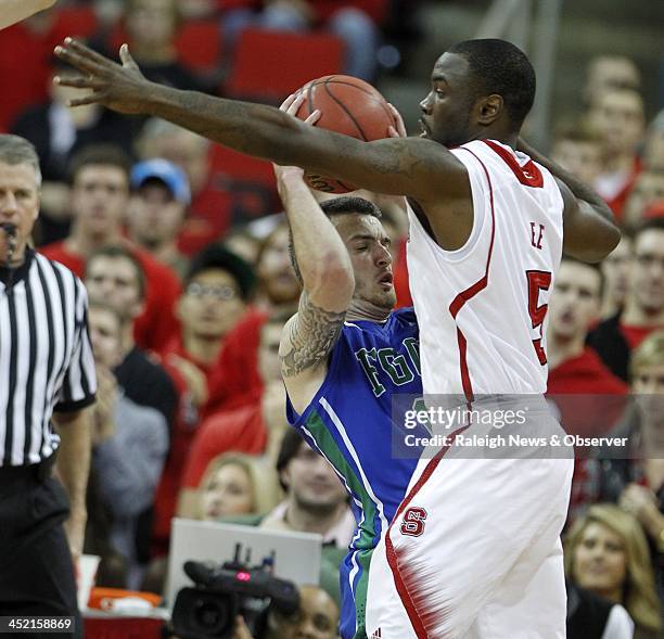 North Carolina State's Desmond Lee pressures Florida Gulf Coast's Brett Comer during the first half at PNC Arena in Raleigh, N.C., on Tuesday, Nov....