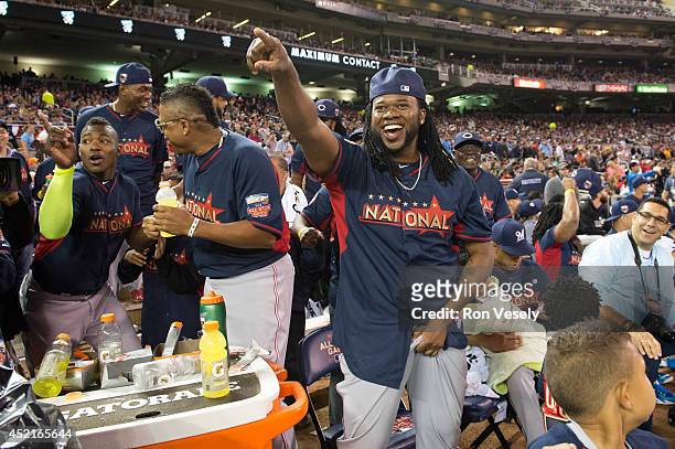 Johnny Cueto of the Cincinnati Reds reacts to a Todd Frazier of the Cincinnati Reds home run during the Gillette Home Run Derby at Target Field on...