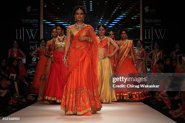 Dia Mirza walks the runway in an Shobha Shringar design during day 1 of the India International Jewellery Week 2014 at grand Hyatt on July 14, 2014...