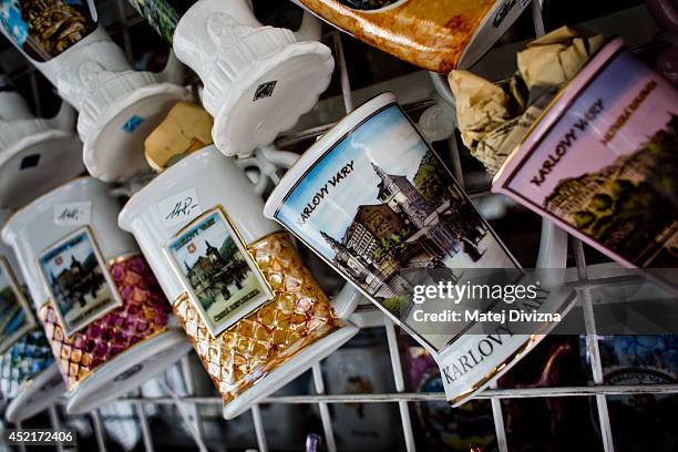 Traditional cups for fresh mineral-rich water are display for sale on July 12, 2014 in Karlovy Vary, Czech Republic. Karlovy Vary, known for its...