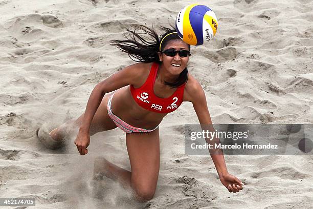 Vivian Baella of Peru competes in a beach volleyball match between Peru and Venezuela as part of the XVII Bolivarian Games Trujillo 2013 at Sports...