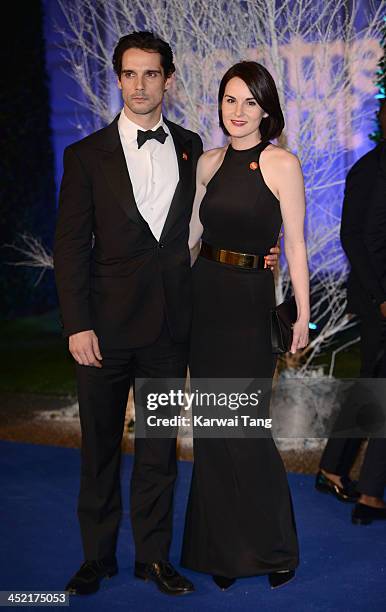 John Dineen and Michelle Dockery attend the Winter Whites Gala in aid of Centrepoint at Kensington Palace on November 26, 2013 in London, England.