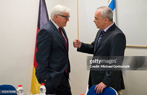 German Foreign Minister Frank-Walter Steinmeier and Israeli Minister of Intelligence, Yuval Steinitz, talk to each other at the Israeli Ministry of...