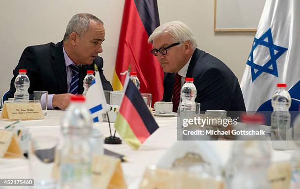 German Foreign Minister Frank-Walter Steinmeier and Israeli Minister of Intelligence, Yuval Steinitz, talk to each other at the Israeli Ministry of...