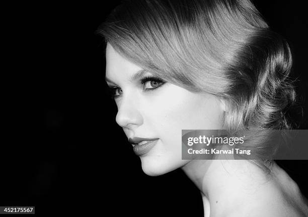 Taylor Swift attends the Winter Whites Gala in aid of Centrepoint at Kensington Palace on November 26, 2013 in London, England.