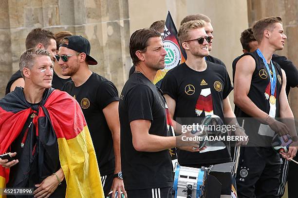Germany's midfielder Bastian Schweinsteiger, defender Shkodran Mustafi, goalkeeper Roman Weidenfeller, midfielder Andre Schuerrle and defender Erik...