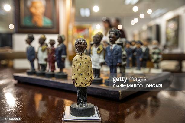 Chessboard, showing black members of South Africa's post-apartheid government , including late President Nelson Mandela as the the king figurine, and...