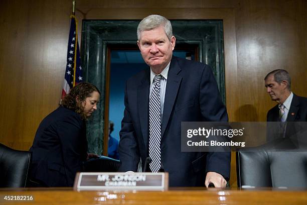 Senator Tim Johnson, a Democrat from South Dakota and chairman of the Senate Banking Committee, arrives to a Senate Banking Committee hearing in...