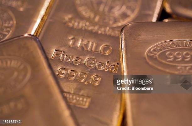 One kilogram gold bars are seen in this arranged photograph at Gold Investments Ltd. Bullion dealers in London, U.K., on Tuesday, July 15, 2014. Gold...