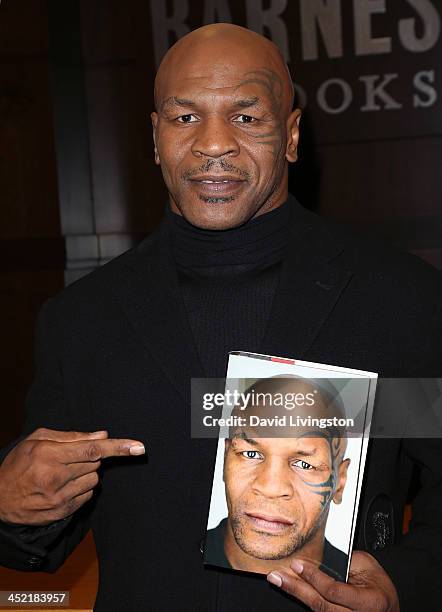 Former boxer Mike Tyson attends a signing for his book "Undisputed Truth" at Barnes & Noble bookstore at The Grove on November 26, 2013 in Los...