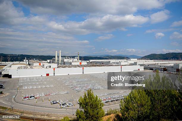 Newly-manufactured vehicles sit in a covered parking lot outside Volkswagen AG's Seat automobile plant in Martorell, Spain, on Tuesday, July 15,...