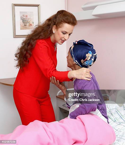 Princess Lalla Salma of Morocco meets a cancer patient during a visit to Lalla Salma Centre for Research Against Cancer on July 15, 2014 in Rabat,...