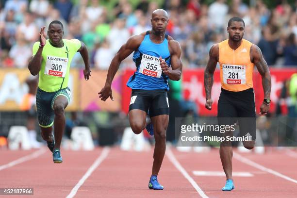Kemarley Brown , Asafa Powell and Keston Bledman compete in the Men's 100m race at the EAA Premium Meeting Lucerne on July 15, 2014 in Lucerne,...