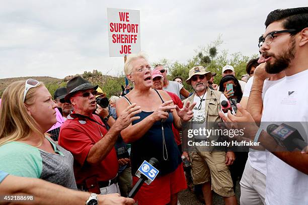 Anti-immigration activists, including Linda Slay confront pro-immigration activist Jose Magana and others during a protest along Mt. Lemmon Road in...