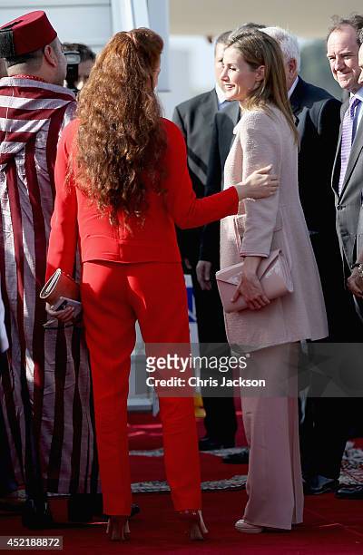 Queen Letizia of Spain embraces Princess Lalla Salma of Moroccoas the Spanish Royals prepare to leave at Rabat Airport on July 15, 2014 in Rabat,...