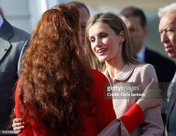 Queen Letizia of Spain embraces Princess Lalla Salma of Moroccoas the Spanish Royals prepare to leave at Rabat Airport on July 15, 2014 in Rabat,...
