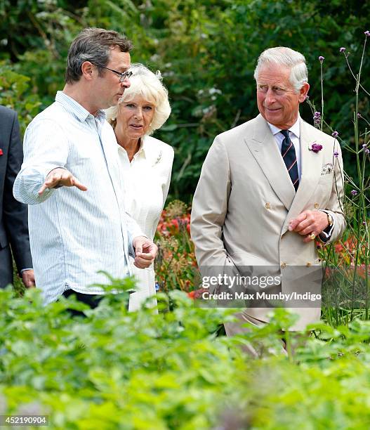 Hugh Fearnley-Whittingstall gives Prince Charles, Prince of Wales and Camilla, Duchess of Cornwall a tour the vegetable garden as they visit River...