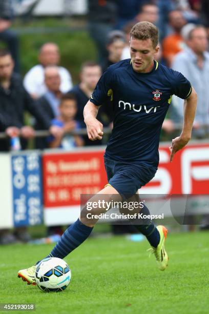 Sam Gallagher of Southampton runs with the ball during the pre season friendly match between EHC Hoensbroek and Southampton at Sportpark De Dem on...