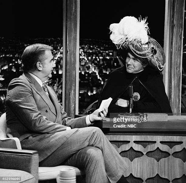 Pictured: Announcer Ed McMahon and host Johnny Carson as Carnac the Magnificent on November 17, 1970 --