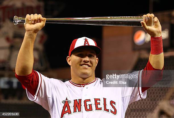 American League All-Star Mike Trout of the Los Angeles Angels poses with the MVP trophy after a 5-3 victory over the National League All-Stars during...