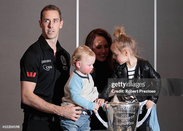Nick Maxwell poses with his family after speaking to the media, announcing his retirement, during a Collingwood Magpies AFL press conference at the...