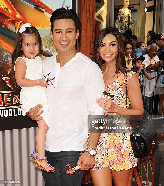 Mario Lopez, Courtney Mazza and daughter Gia Francesca Lopez attend the premiere of "Planes: Fire & Rescue" at the El Capitan Theatre on July 15,...