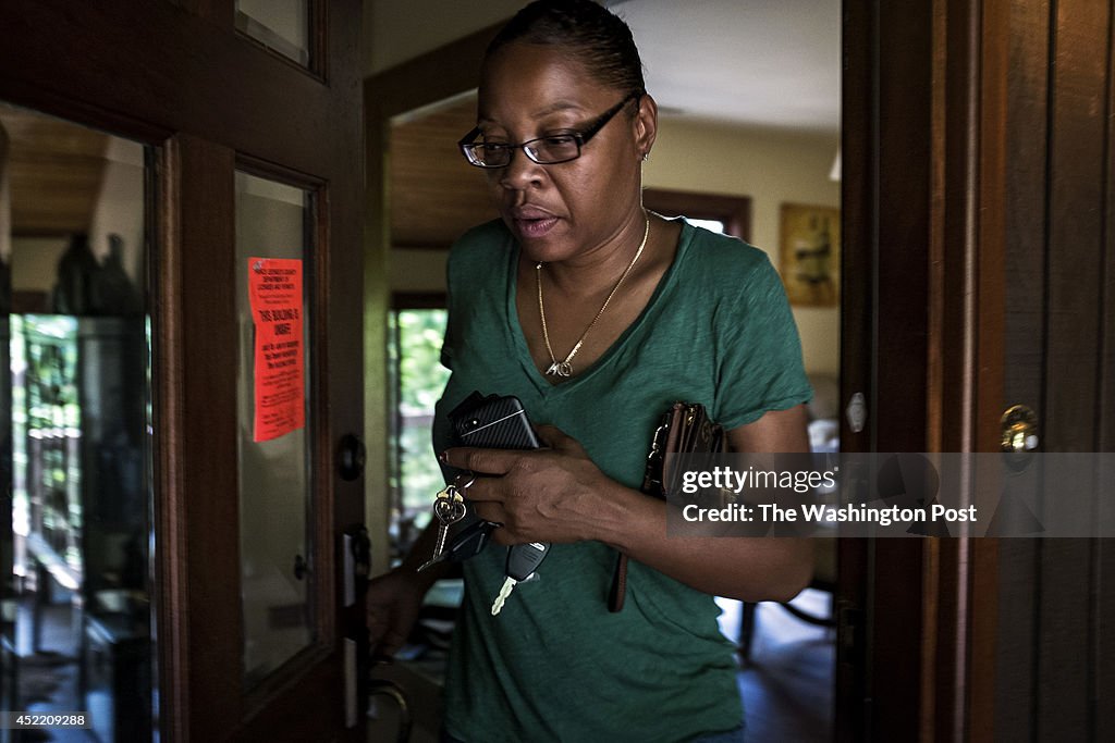 Tracy Rookard Tracy Rookard walks out the door of her home, declared unsafe to ...