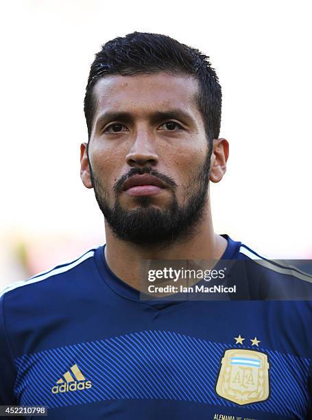 Ezequiel Garay of Argentina looks on during the anthems during the 2014 World Cup final match between Germany and Argentina at The Maracana Stadium...