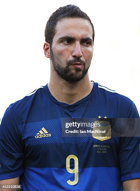 Gonzalo Higuain of Argentina looks on during the anthems during the 2014 World Cup final match between Germany and Argentina at The Maracana Stadium...