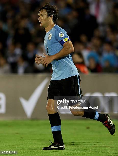 Diego Lugano of Uruguay runs during leg 2 of the FIFA World Cup Qualifier match between Uruguay and Jordan at Centenario Stadium Stadium on November...