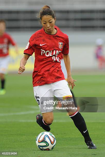 Ami Otaki of Urawa Reds Ladies in action during the Nadeshiko League 2014 match between Urawa Reds Ladies and Albirex Niigata Ladies at Urawa Komaba...