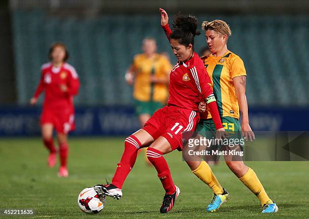 Michelle Heyman of the Matildas defends against Wei Pu of China during the Women's International Friendly match between the Australian Matildas and...