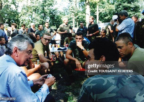 Photo taken on July 23, 1995 shows then Dutch Prime Minister Wim Kok talking to UN troops at Camp Pleso in Zagreb after they returned from Potocari...