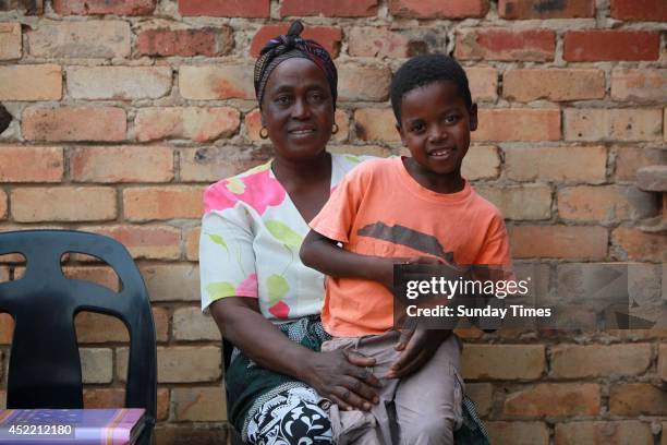 Sanele Masilela, a nine year-old with his wife Helen Shabangu, 62 year-old on July 14, 2014 in Bushbuckridge, South Africa. Sanele who married Helen...