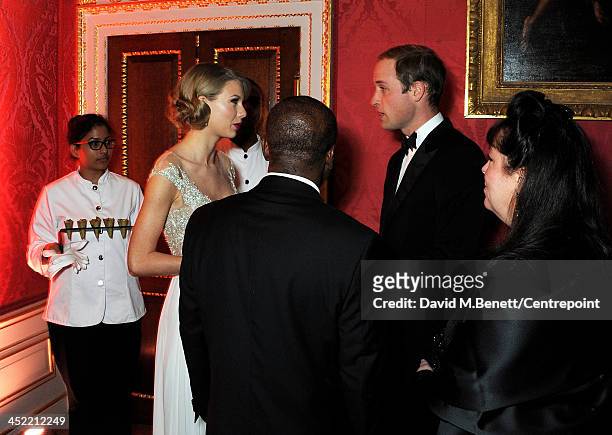Taylor Swift , Prince William, Duke of Cambridge , and Centrepoint Board of Trustee Danielle Alexandra,Gala Chair and Producer attend the Winter...