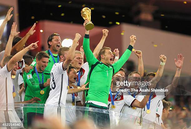 Manuel Neuer of Germany lifts the World Cup trophy during the award ceremony after the 2014 FIFA World Cup Brazil Final match between Germany and...