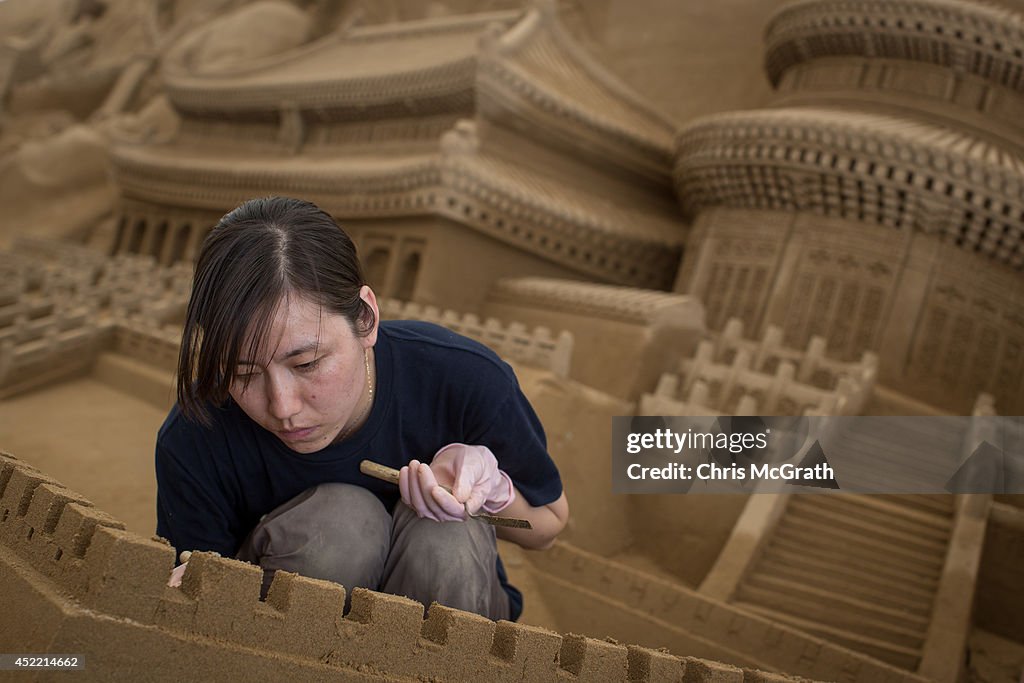 Artists Work On Sand Art Ahead Of "Culture City of East Asia 2014" Exhibition