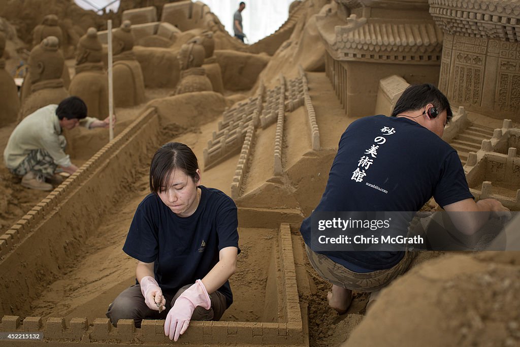 Artists Work On Sand Art Ahead Of "Culture City of East Asia 2014" Exhibition