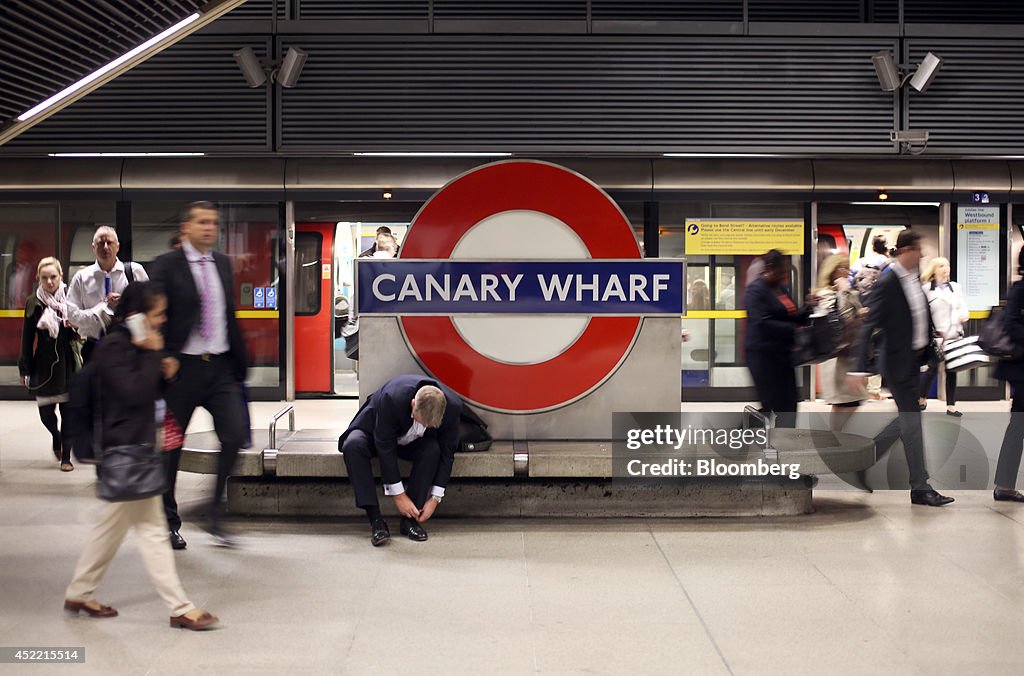 Commuters Arrive For Work At Canary Wharf London Underground Station