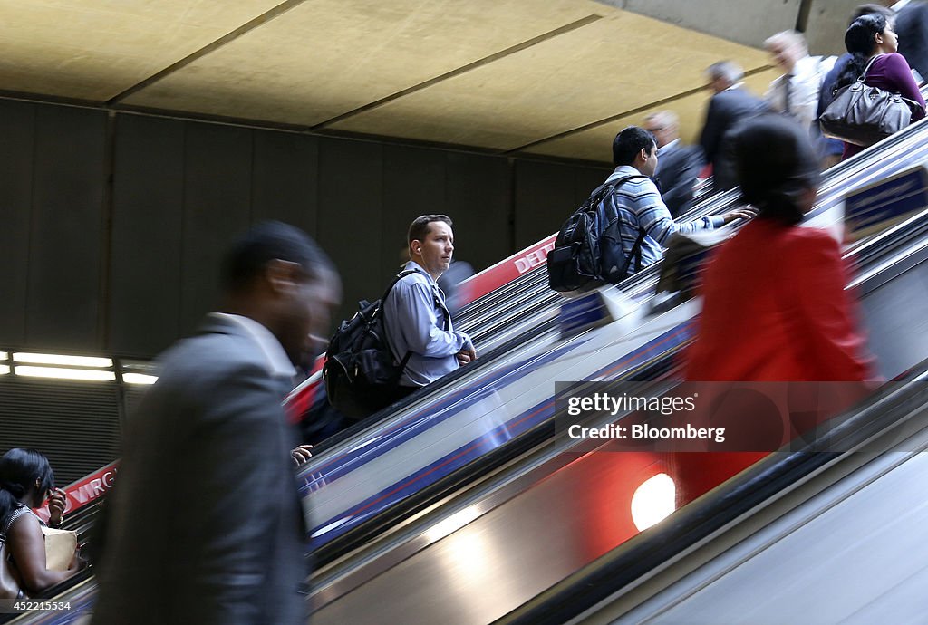 Commuters Arrive For Work At Canary Wharf London Underground Station