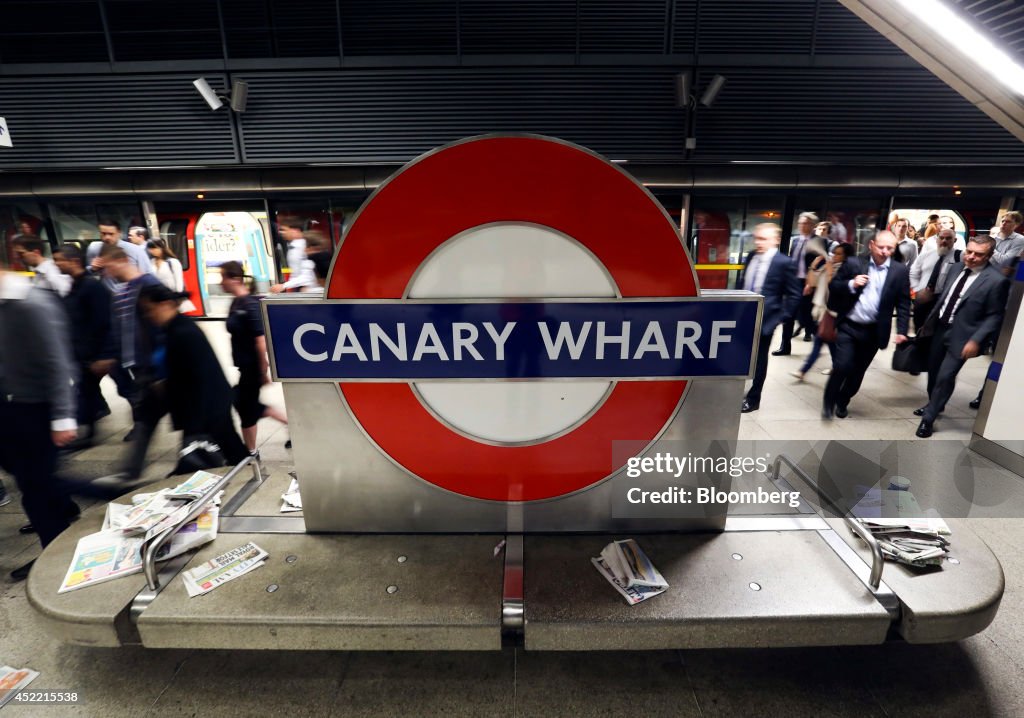 Commuters Arrive For Work At Canary Wharf London Underground Station