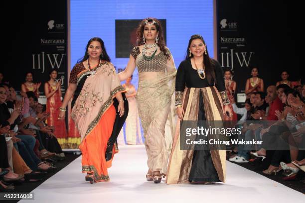 Raveena Tandon walks the runway at the Dipti & Amisha show during day 2 of the India International Jewellery Week 2014 at grand Hyatt on July 15,...