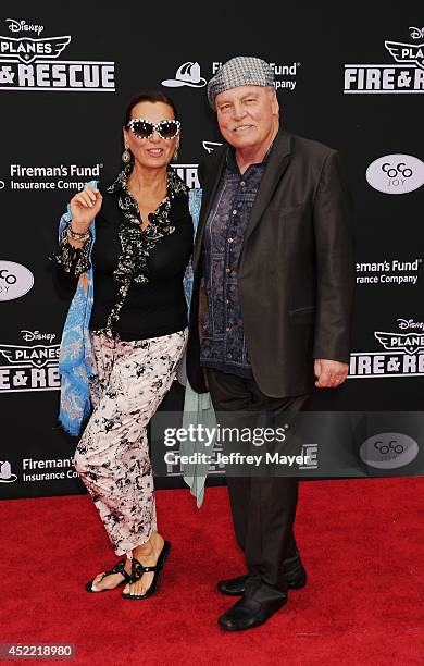 Actor Stacy Keach and wife Malgosia Tomassi arrive at the Los Angeles premiere of Disney's 'Planes: Fire & Rescue' at the El Capitan Theatre on July...