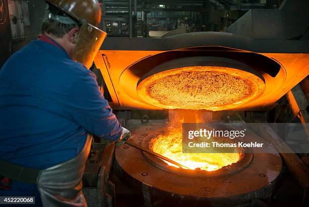 Worker monitoring a blast furnace of the Ortrander Eisenhuette GmbH, an ironworks on July 03 in Ortrand, Germany. The ironworks manufactures with...